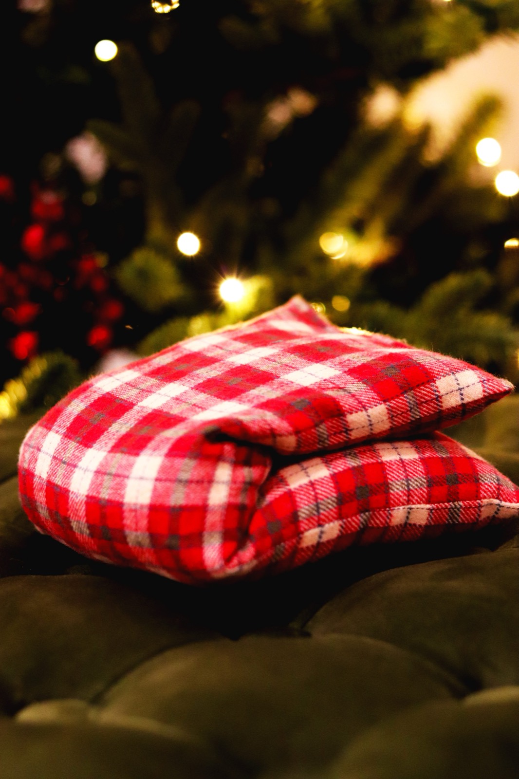 Red plaid fabric heat compress pouches stacked